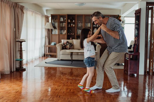 image of a family dancing in the living room