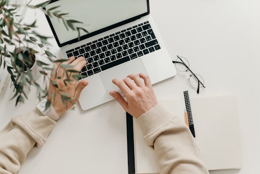 freelancer working on laptop with coffee