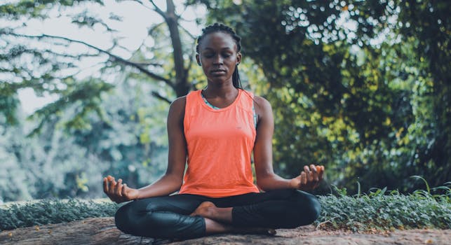 person meditating in nature