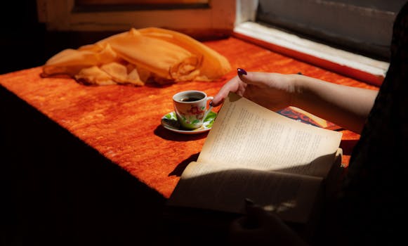 a freelancer enjoying a break with a book and coffee