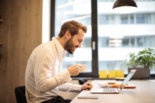 freelancer working at a desk with a cup of coffee