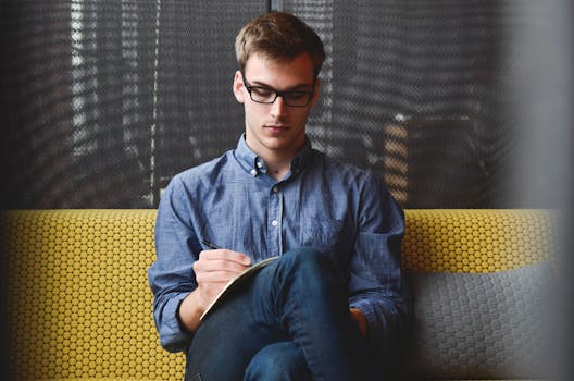 image of a person writing in a journal